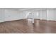This basement features wood-look flooring, white walls, and ample space for various activities at 3046 Wendgate Dr, Marietta, GA 30062