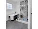 Bathroom featuring black soaking tub, sleek shower with glass door, and marble accents at 3046 Wendgate Dr, Marietta, GA 30062