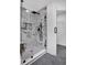 Bathroom with marble shower, glass door, and modern black fixtures at 3046 Wendgate Dr, Marietta, GA 30062