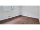 Bedroom featuring hardwood floors, white walls, and a window bringing in lots of natural light at 3046 Wendgate Dr, Marietta, GA 30062