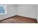A compact bedroom with a neutral color scheme and wood-look flooring offers a serene ambiance at 3046 Wendgate Dr, Marietta, GA 30062