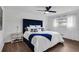 Bedroom featuring a navy tufted headboard, soft bedding, and natural light from the window at 3046 Wendgate Dr, Marietta, GA 30062