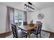Dining room with modern lighting, view to outside, with seating for four at 3046 Wendgate Dr, Marietta, GA 30062