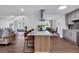 Stylish kitchen with a large center island, stainless hood, and a view to the dining area at 3046 Wendgate Dr, Marietta, GA 30062