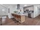 Well-lit kitchen with bar seating, stainless appliances, and a modern aesthetic at 3046 Wendgate Dr, Marietta, GA 30062