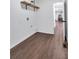 This laundry room features wood-look flooring, a shelf, and white walls at 3046 Wendgate Dr, Marietta, GA 30062