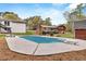 A beautiful backyard featuring a pool, a diving board, decks, and mature trees at 3046 Wendgate Dr, Marietta, GA 30062