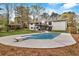 A beautiful backyard featuring a pool, a diving board, a deck, and a grassy area at 3046 Wendgate Dr, Marietta, GA 30062