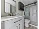 Modern bathroom featuring a vanity with black fixtures and glass door shower at 1010 Martin Ln, Canton, GA 30114