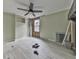 Spacious bedroom featuring light-colored walls, wood-look floors, and a ceiling fan at 1010 Martin Ln, Canton, GA 30114