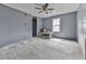 Bedroom with a ceiling fan and natural light, offering ample space for furnishings and personal touches at 1010 Martin Ln, Canton, GA 30114