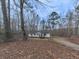 A single Gathering home with a yard and surrounded by mature trees at 1010 Martin Ln, Canton, GA 30114