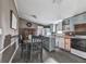 Kitchen area with cabinetry, appliances, and adjacent dining space, offering potential for renovation at 1010 Martin Ln, Canton, GA 30114