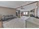 Spacious living room with a ceiling fan, fireplace, and natural light from unfinished windows at 1010 Martin Ln, Canton, GA 30114