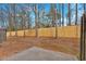 Spacious fenced backyard providing privacy and room for outdoor activities at 1795 Waterside Nw Dr, Kennesaw, GA 30152