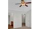 Bright bedroom featuring a ceiling fan, neutral walls, and an open doorway to the bathroom at 1795 Waterside Nw Dr, Kennesaw, GA 30152