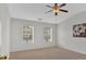 Bright bedroom with a ceiling fan, natural light, and neutral wall paint at 1795 Waterside Nw Dr, Kennesaw, GA 30152