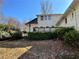 Backyard with an elevated deck, steps, and mature landscaping and foliage at 1920 Anastasia Ln, Atlanta, GA 30341