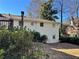 Exterior view of the home highlighting the large yard, mature trees, and outdoor space at 1920 Anastasia Ln, Atlanta, GA 30341