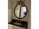 Bathroom features an elegant vanity with granite countertop and decorative mirror at 1920 Anastasia Ln, Atlanta, GA 30341