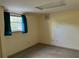 Bedroom with neutral walls, window and carpet at 1920 Anastasia Ln, Atlanta, GA 30341