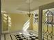 Bright dining room with black and white tile floors and elegant chandelier at 1920 Anastasia Ln, Atlanta, GA 30341