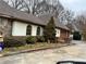 Charming exterior of a home with a stone accent and a well-manicured front yard at 1920 Anastasia Ln, Atlanta, GA 30341