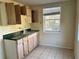 Galley kitchen featuring tile floor, spacious countertops, and a window at 1920 Anastasia Ln, Atlanta, GA 30341