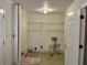 Empty laundry room with shelving and tile floors at 1920 Anastasia Ln, Atlanta, GA 30341