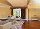 Cozy living room boasts hardwood floors, elegant curtains and furniture at 1920 Anastasia Ln, Atlanta, GA 30341