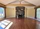 Spacious living room with hardwood floors, large fireplace, and ample natural light at 1920 Anastasia Ln, Atlanta, GA 30341