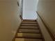 Interior staircase featuring wood railing and steps at 1920 Anastasia Ln, Atlanta, GA 30341