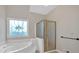 Bathroom with Jacuzzi tub and glass shower at 3229 Cobbs Farm Nw Trl, Marietta, GA 30064