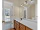 Well-lit bathroom featuring a sink, vanity, and medicine cabinet at 3229 Cobbs Farm Nw Trl, Marietta, GA 30064