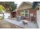 Secluded backyard patio with a grill, gravel landscaping, and outdoor seating at 233 Tara Commons Walk, Loganville, GA 30052