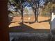 Fenced backyard with low maintenance ground cover is shown from the patio at 233 Tara Commons Walk, Loganville, GA 30052