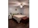 Bedroom with hardwood floors, ceiling fan and light blue walls at 233 Tara Commons Walk, Loganville, GA 30052