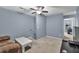 Spacious bonus room with a comfortable sofa, TV, and neutral carpet at 233 Tara Commons Walk, Loganville, GA 30052