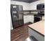 Bright kitchen with stainless steel appliances, white cabinets, and laminate countertops at 233 Tara Commons Walk, Loganville, GA 30052