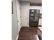 Bright kitchen featuring stainless steel appliances, white cabinets, and a door to an adjacent room at 233 Tara Commons Walk, Loganville, GA 30052