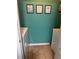 A clean laundry room is decorated with a set of amusing wall hangings at 233 Tara Commons Walk, Loganville, GA 30052