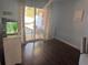 Bright living room with hardwood floors and a sliding glass door to the exterior at 233 Tara Commons Walk, Loganville, GA 30052