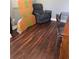 The room is filled with furniture, including an armchair and a desk at 233 Tara Commons Walk, Loganville, GA 30052
