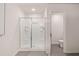 The bathroom features a step-in shower with glass doors, and view of a separate toilet area at 1342 Magnolia Way Bnd # 287, Jonesboro, GA 30238