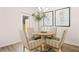 Cozy dining area with modern decor and natural light streaming in through a large window at 1342 Magnolia Way Bnd # 287, Jonesboro, GA 30238