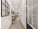 Bright hallway with light-wood floors and a view into the well-lit living area at 1342 Magnolia Way Bnd # 287, Jonesboro, GA 30238