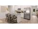 Modern kitchen boasts an island with seating, stainless steel appliances, and white cabinets at 1342 Magnolia Way Bnd # 287, Jonesboro, GA 30238