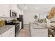 Stylish kitchen featuring granite countertops, stainless steel appliances, and ample cabinet space at 1342 Magnolia Way Bnd # 287, Jonesboro, GA 30238