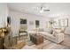 Open-concept living room featuring large windows, a comfortable seating area, and stylish decor at 1342 Magnolia Way Bnd # 287, Jonesboro, GA 30238