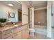 Well-lit bathroom with granite countertop vanity and shower-tub combination at 3324 Peachtree Ne Rd # 2118, Atlanta, GA 30326